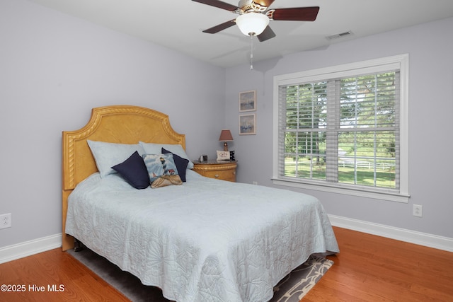555 Dawson Creek Dr, Arapahoe, NC 28510 - bedroom featuring wood finished floors, baseboards, and ceiling fan