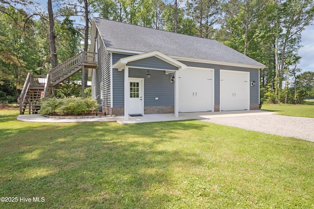 555 Dawson Creek Dr, Arapahoe, NC 28510 - view of front facade featuring stairway, a shingled roof, a front lawn, and gravel driveway