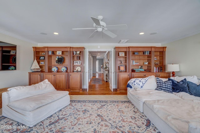 living area featuring ornamental molding, light wood finished floors, ceiling fan, and recessed lighting