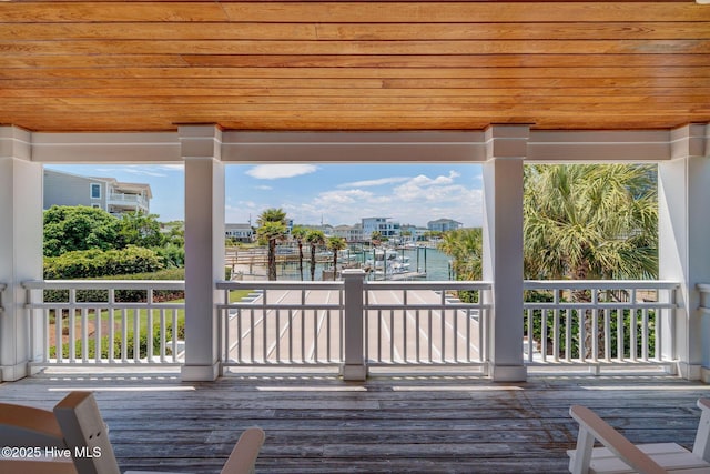 wooden deck with a water view