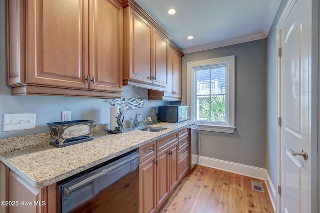 kitchen with baseboards, crown molding, dishwasher, light wood-type flooring, and light stone counters