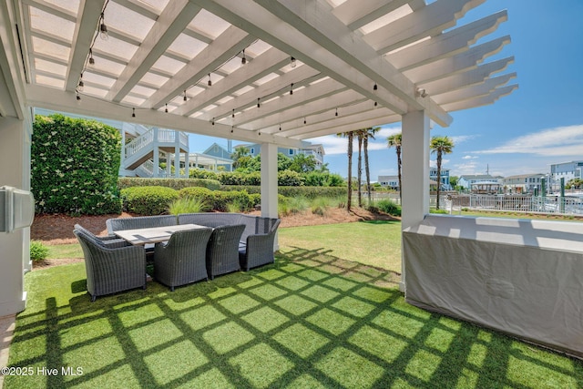 view of yard featuring a pergola and outdoor dining area