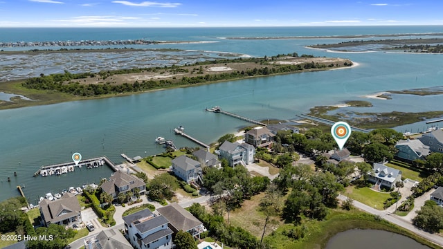 view of property location with a large body of water and nearby suburban area