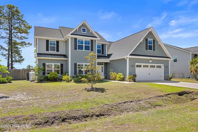 craftsman inspired home featuring driveway, a garage, a standing seam roof, and a shingled roof
