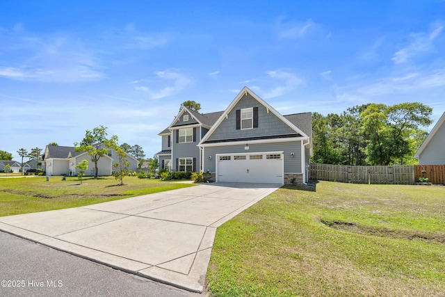 view of front of house featuring stone siding, driveway, and an attached garage