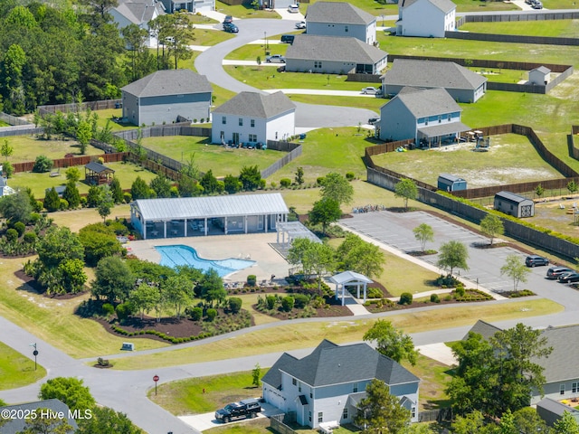 aerial view of residential area with a pool