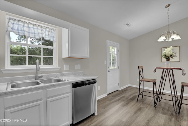 117 Clint Mills Rd, Maysville, NC 28555 - kitchen featuring stainless steel dishwasher, a sink, light wood-type flooring, white cabinetry, and light countertops