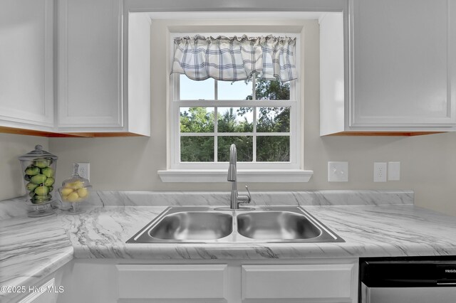 117 Clint Mills Rd, Maysville, NC 28555 - kitchen featuring dishwasher, a sink, and white cabinets