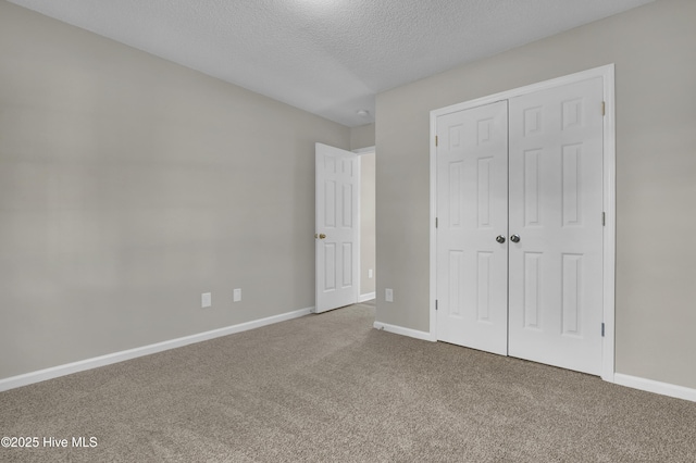 117 Clint Mills Rd, Maysville, NC 28555 - unfurnished bedroom with carpet floors, a textured ceiling, baseboards, and a closet
