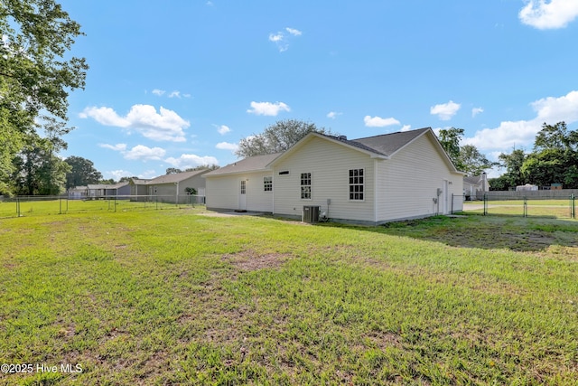 117 Clint Mills Rd, Maysville, NC 28555 - back of property featuring central AC unit, a gate, and crawl space
