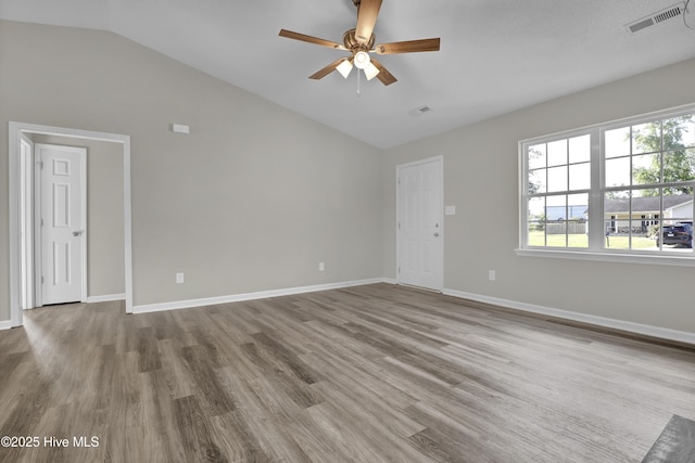 117 Clint Mills Rd, Maysville, NC 28555 - unfurnished room with lofted ceiling, a ceiling fan, wood finished floors, and baseboards