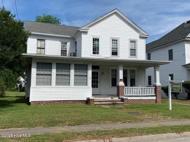 view of front facade with a porch and a front lawn