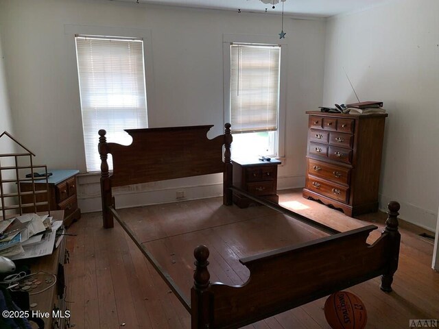 bedroom with hardwood / wood-style flooring