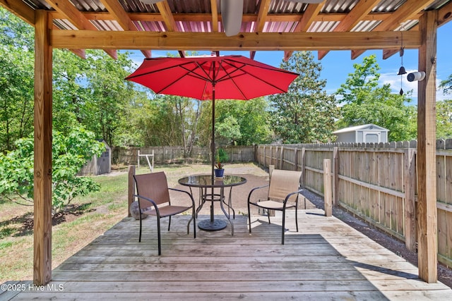 deck with a fenced backyard