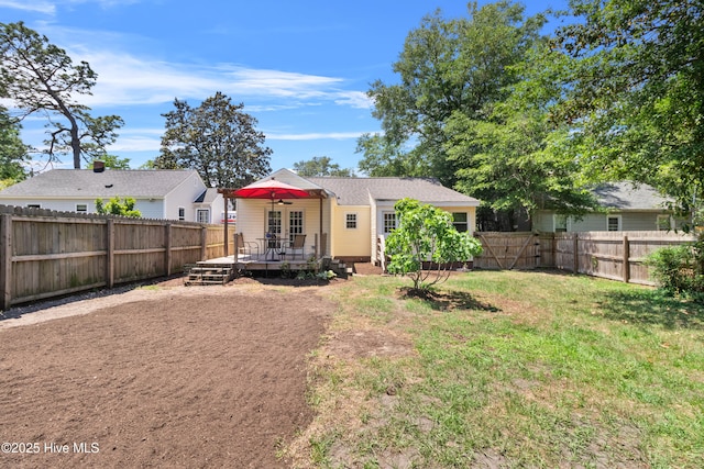 back of property featuring a deck