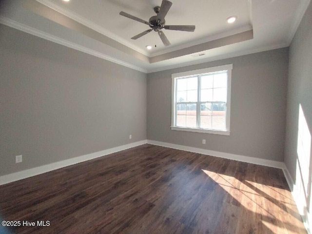 351 Newell Rd, Snow Hill, NC 28580 - empty room with a tray ceiling, ornamental molding, dark wood-type flooring, recessed lighting, and baseboards