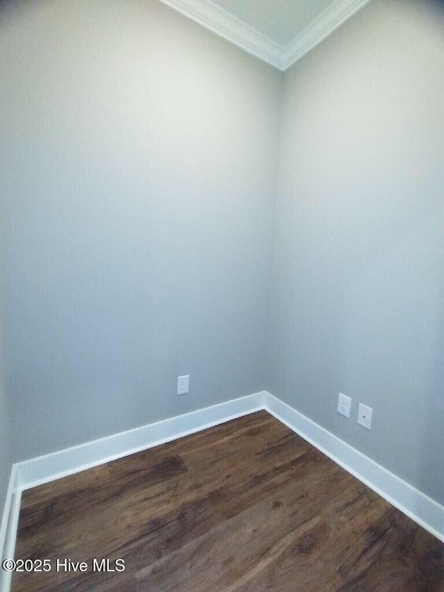 351 Newell Rd, Snow Hill, NC 28580 - empty room featuring crown molding, dark wood-style flooring, and baseboards