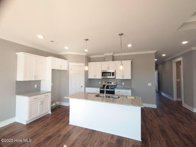 351 Newell Rd, Snow Hill, NC 28580 - kitchen with stainless steel appliances, decorative backsplash, light stone countertops, a sink, and recessed lighting