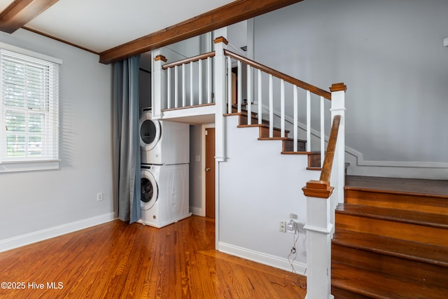 1306 W Church St, Elizabeth City, NC 27909 - laundry room featuring stacked washer / dryer, wood finished floors, and baseboards