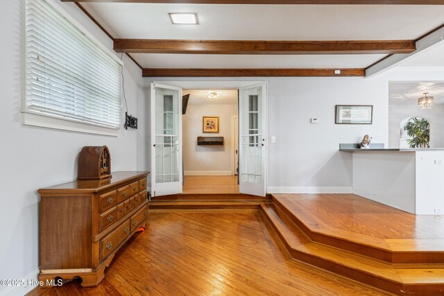 1306 W Church St, Elizabeth City, NC 27909 - entrance foyer with beam ceiling, wood finished floors, baseboards, a chandelier, and french doors