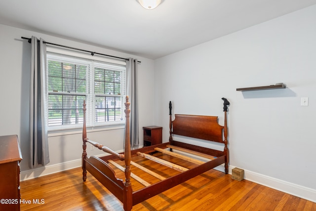 1306 W Church St, Elizabeth City, NC 27909 - bedroom featuring baseboards and light wood-type flooring