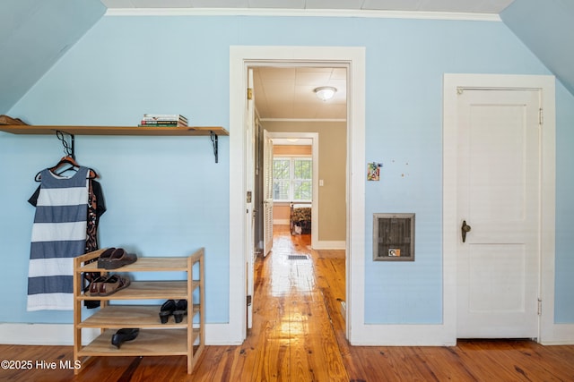 1306 W Church St, Elizabeth City, NC 27909 - hallway featuring wood-type flooring, ornamental molding, vaulted ceiling, and baseboards