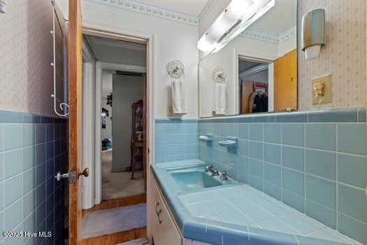 117 Arthur Rd, Beaufort, NC 28516 - bathroom featuring tile walls, wallpapered walls, a wainscoted wall, and vanity