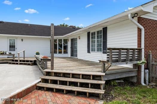 117 Arthur Rd, Beaufort, NC 28516 - rear view of property with brick siding and a deck