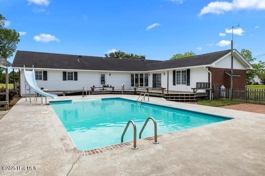 117 Arthur Rd, Beaufort, NC 28516 - view of pool featuring a water slide, fence, a patio, and a wooden deck