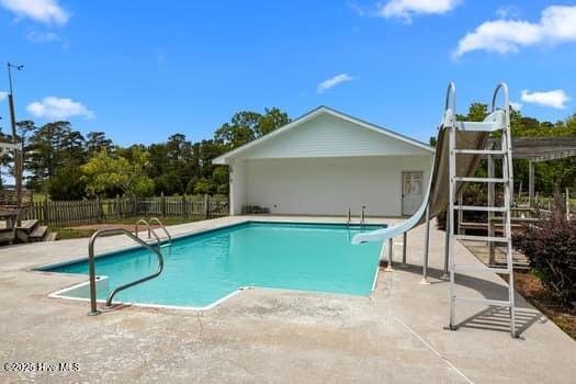 117 Arthur Rd, Beaufort, NC 28516 - view of pool featuring a water slide, a patio, and fence