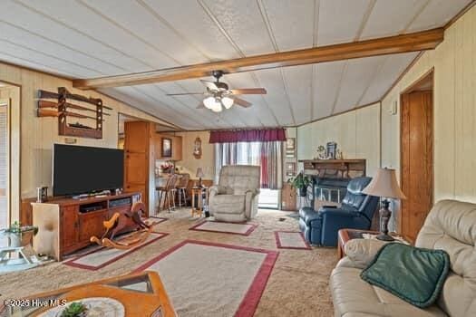 117 Arthur Rd, Beaufort, NC 28516 - carpeted living area featuring ceiling fan and wooden walls