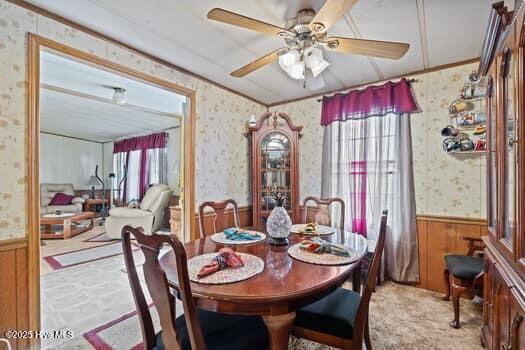 117 Arthur Rd, Beaufort, NC 28516 - dining space featuring wallpapered walls, a wainscoted wall, ceiling fan, and crown molding