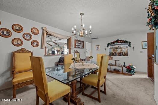 117 Arthur Rd, Beaufort, NC 28516 - carpeted dining area featuring a chandelier