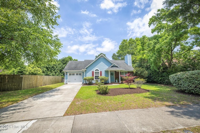 1009 Steeplechase Rd, Wilmington, NC 28412 - view of front of home with driveway, an attached garage, and a chimney