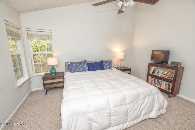 1009 Steeplechase Rd, Wilmington, NC 28412 - carpeted bedroom featuring lofted ceiling, baseboards, and a ceiling fan