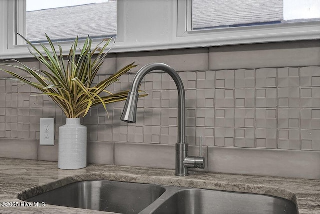 1912 Nun St, Wilmington, NC 28403 - kitchen view of a sink, decorative backsplash, and white cabinets
