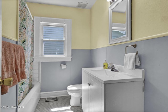 1912 Nun St, Wilmington, NC 28403 - full bathroom with toilet, vanity, shower / bath combo, and tile patterned flooring