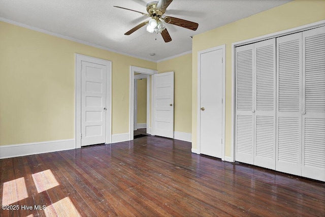 1912 Nun St, Wilmington, NC 28403 - unfurnished bedroom featuring wood-type flooring, baseboards, ornamental molding, a closet, and ceiling fan