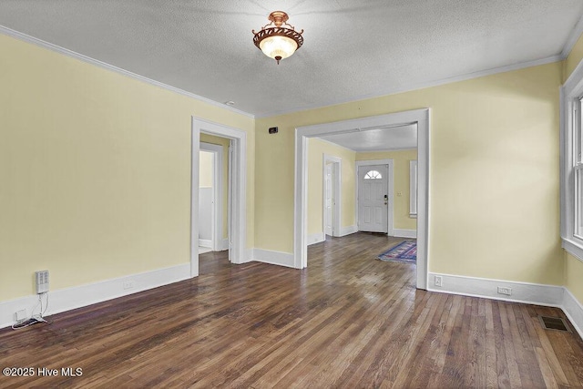 1912 Nun St, Wilmington, NC 28403 - empty room featuring crown molding, wood finished floors, a textured ceiling, and baseboards