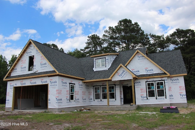 316 Bobbys Dr, Newport, NC 28570 - unfinished property with roof with shingles, an attached garage, and a porch
