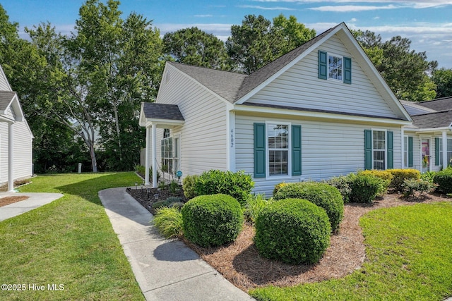 4602 Song Sparrow Ct, Wilmington, NC 28412 - view of home's exterior featuring a shingled roof and a yard
