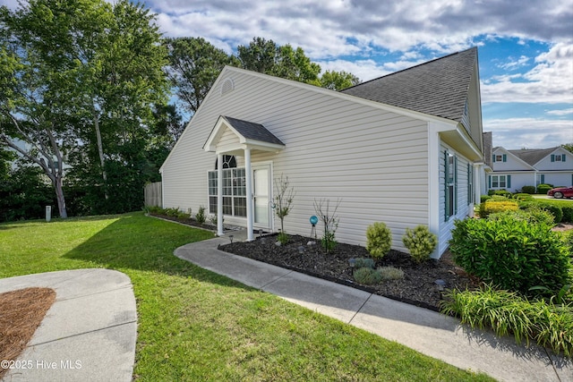 4602 Song Sparrow Ct, Wilmington, NC 28412 - view of front facade featuring roof with shingles and a front yard