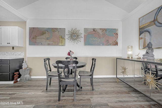 4602 Song Sparrow Ct, Wilmington, NC 28412 - dining room featuring vaulted ceiling, wood finished floors, baseboards, and ornamental molding