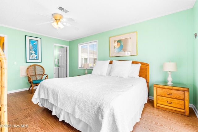 28 E First St Unit 4B, Ocean Isle Beach, NC 28469 - bedroom with light wood-style floors, crown molding, baseboards, connected bathroom, and a ceiling fan