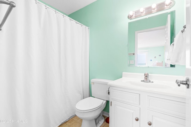 28 E First St Unit 4B, Ocean Isle Beach, NC 28469 - bathroom featuring toilet, vanity, and a shower with curtain