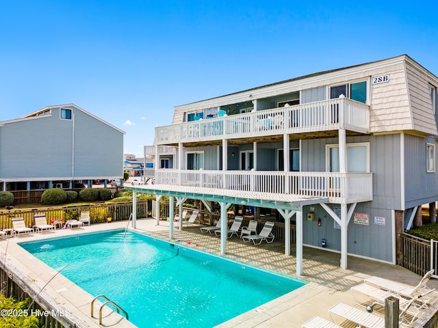 28 E First St Unit 4B, Ocean Isle Beach, NC 28469 - community pool featuring a patio and fence