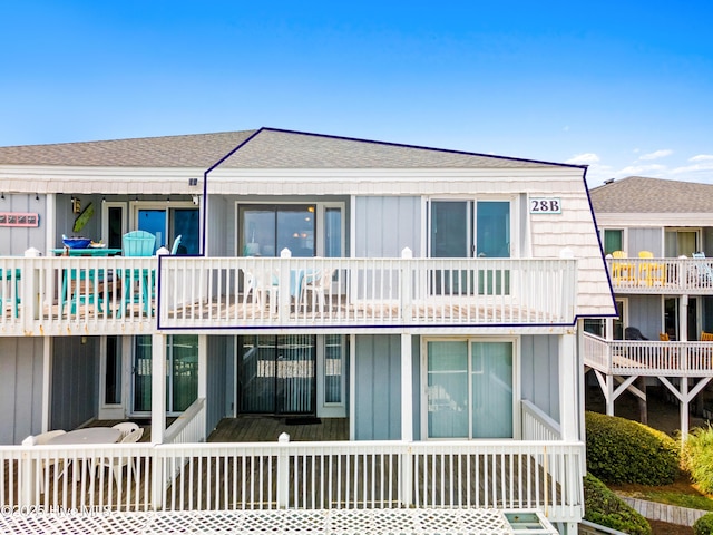 28 E First St Unit 4B, Ocean Isle Beach, NC 28469 - rear view of house with roof with shingles