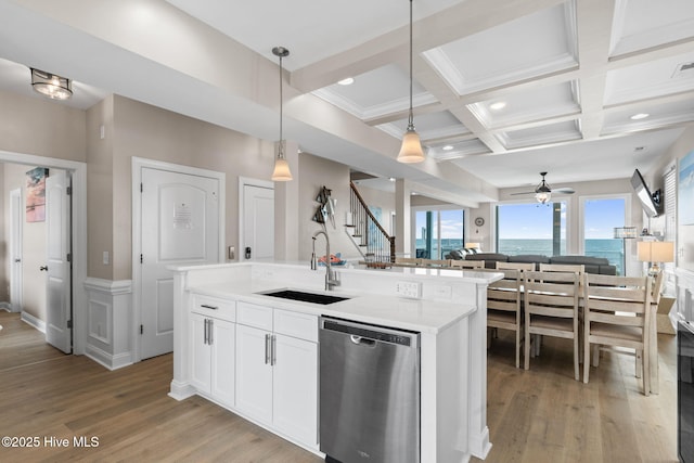 2721 W Beach Dr, Oak Island, NC 28465 - kitchen featuring dishwasher, a sink, a ceiling fan, light wood-type flooring, and open floor plan