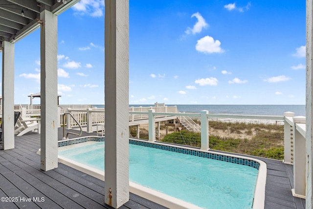 2721 W Beach Dr, Oak Island, NC 28465 - outdoor pool with a deck with water view and a beach view