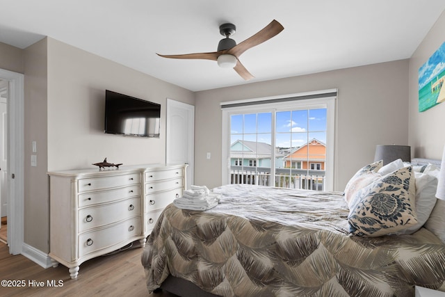 2721 W Beach Dr, Oak Island, NC 28465 - bedroom featuring wood finished floors, baseboards, ceiling fan, and access to exterior
